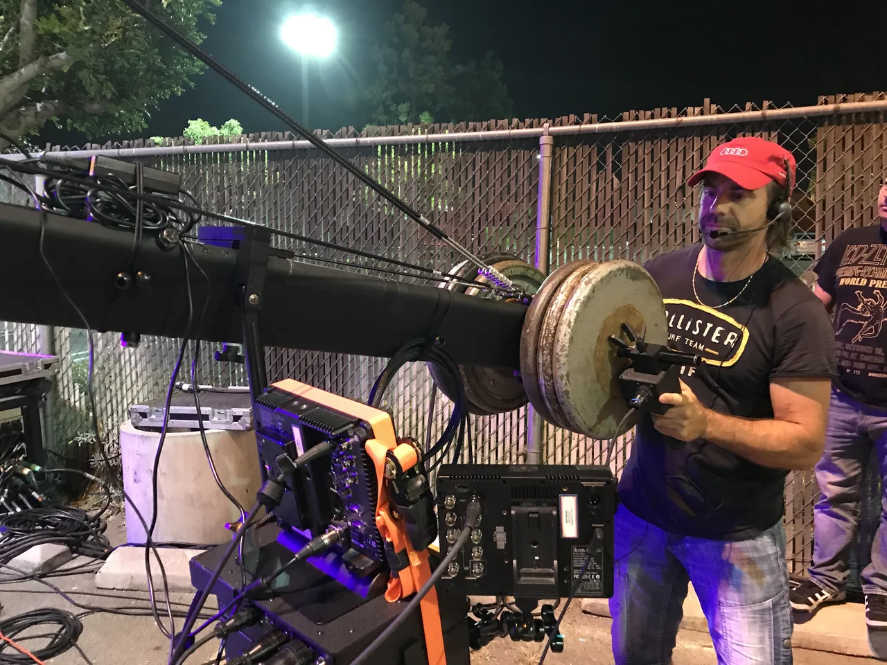 Ariel balancing the counterweight end of a camera crane