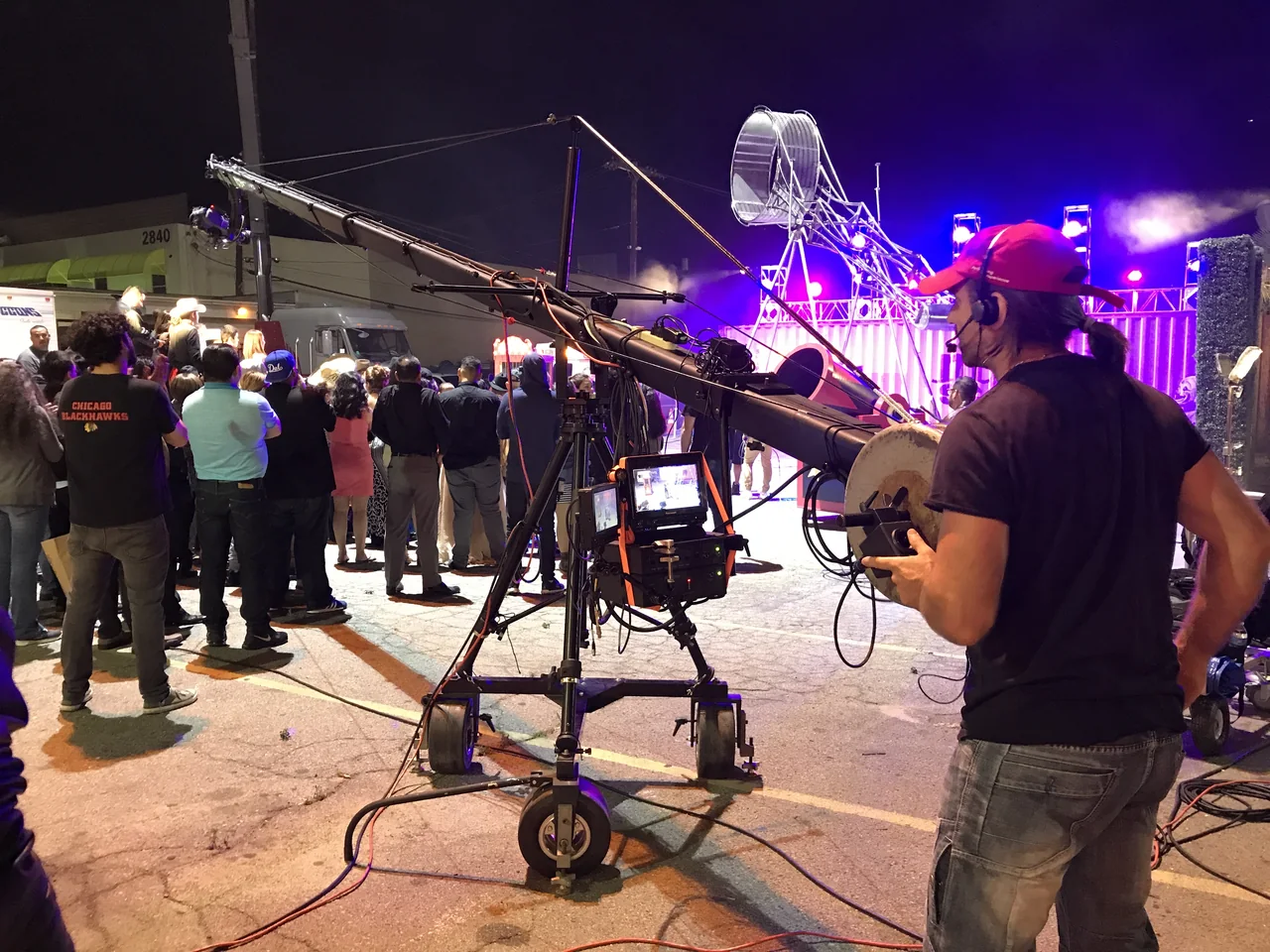 Ariel actively operating a camera crane during a live event