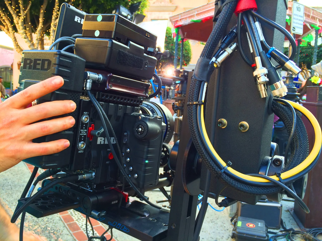 Broadcast camera, lens and cabling mounted to a specialty camera system